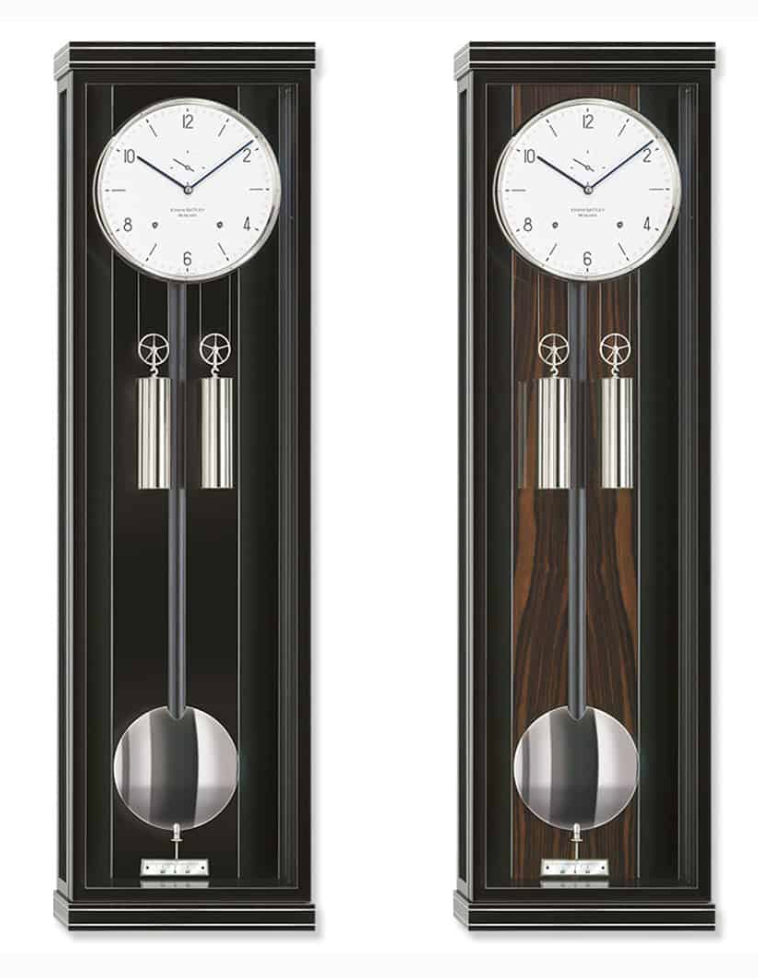 ERWIN SATTLER CLASSICA S 100 M.
Zwart gelakte kast of zwart gelakte kast met Makasar achterwand. Op speciaal verzoek ook leverbaar in notenhout. 98 cm hoog, 27,5 cm breed en 10,5 cm diep. Ontspiegeld mineraal glas. Uurwerk Sattler Kaliber 1515-4. Loopduur 30 dagen. 8 Precisie kogellagers en 15 Robijn lagers. Emaillen wijzerplaat naar keuze Romeins of Arabisch. Slagwerk op de hele en de halve uren op rondgong met repetitie. 